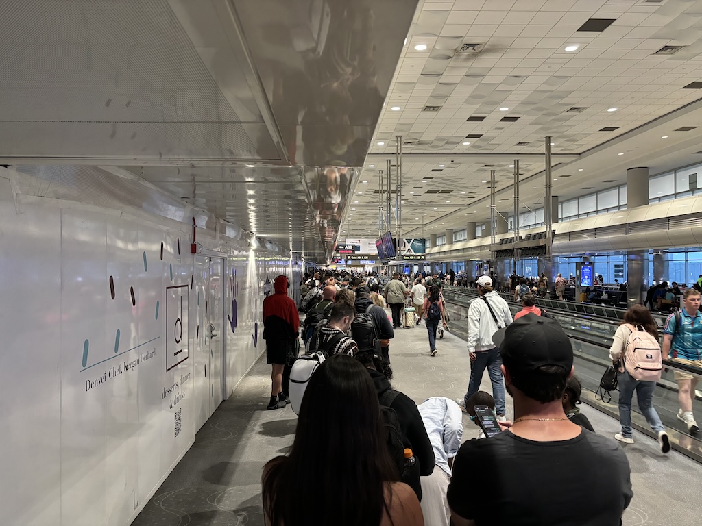 Queueing for the Frontier helpdesk in Denver airport at 20:30