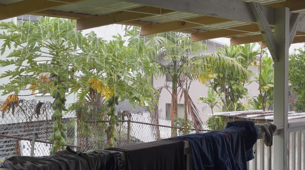 Drying clothes on the terrace in torrential rain