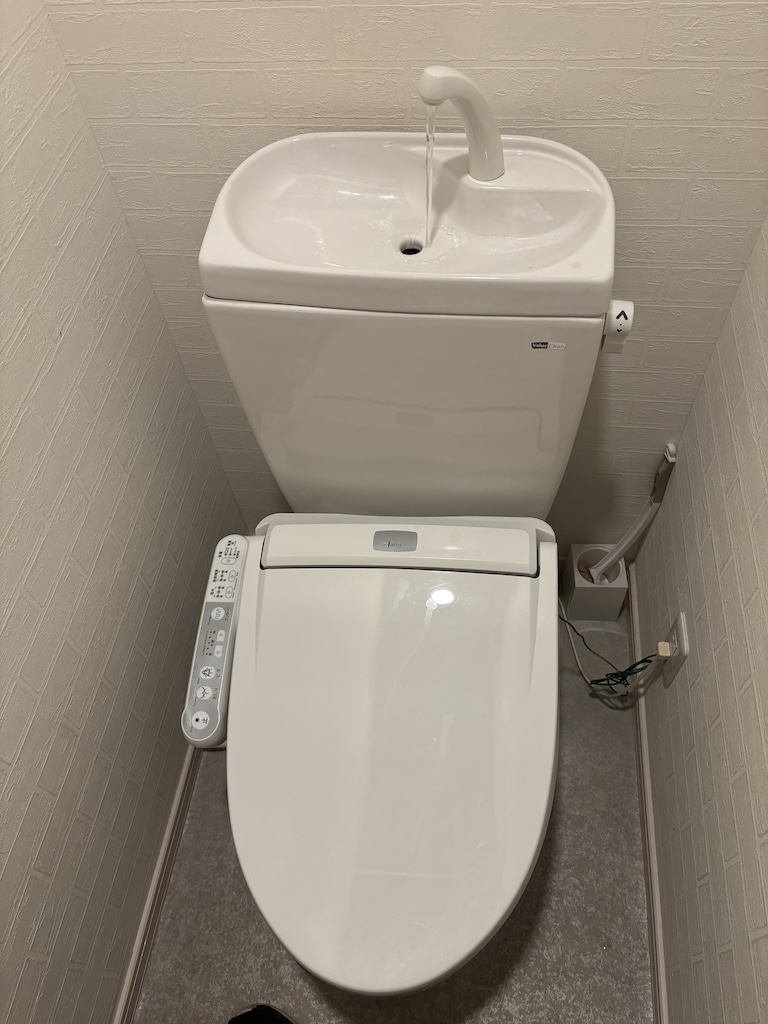 Toilet with it's own sink attached
