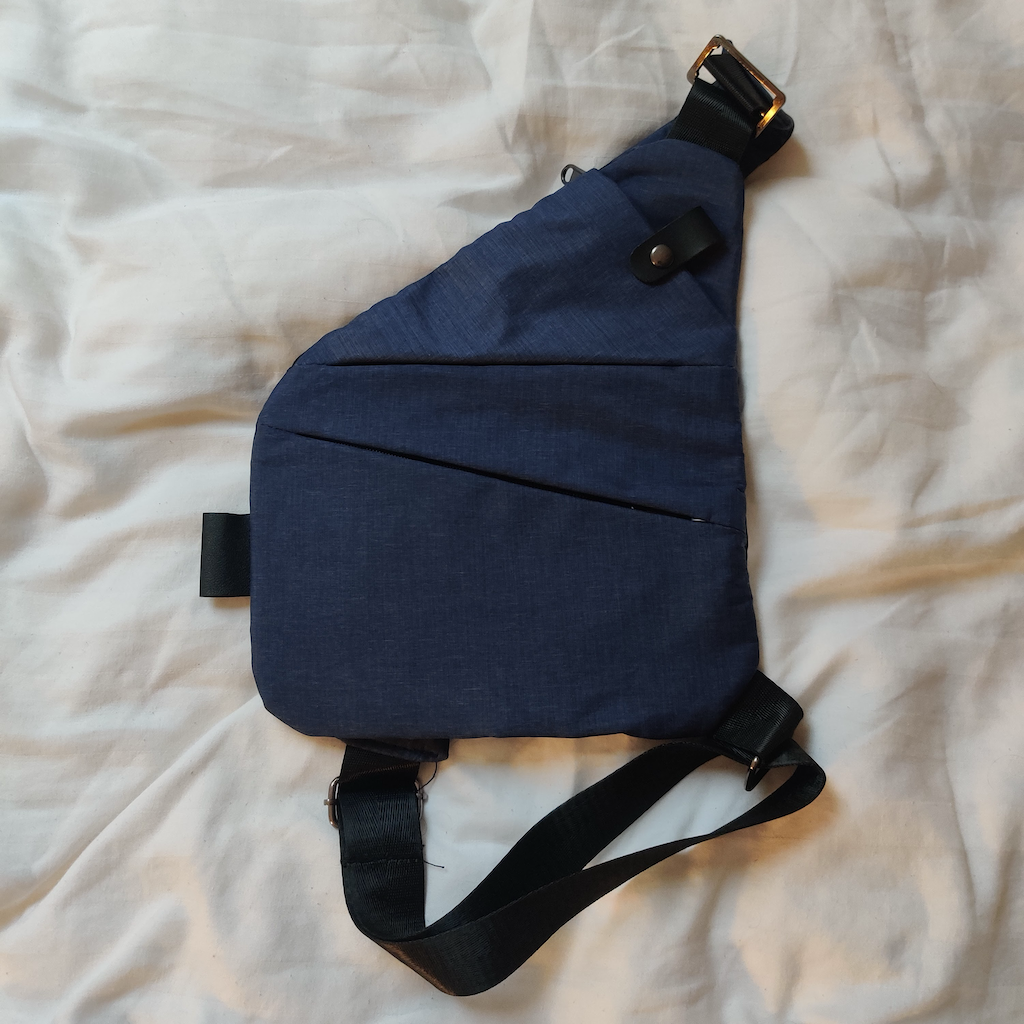 A blue (close to chest) valuables bag